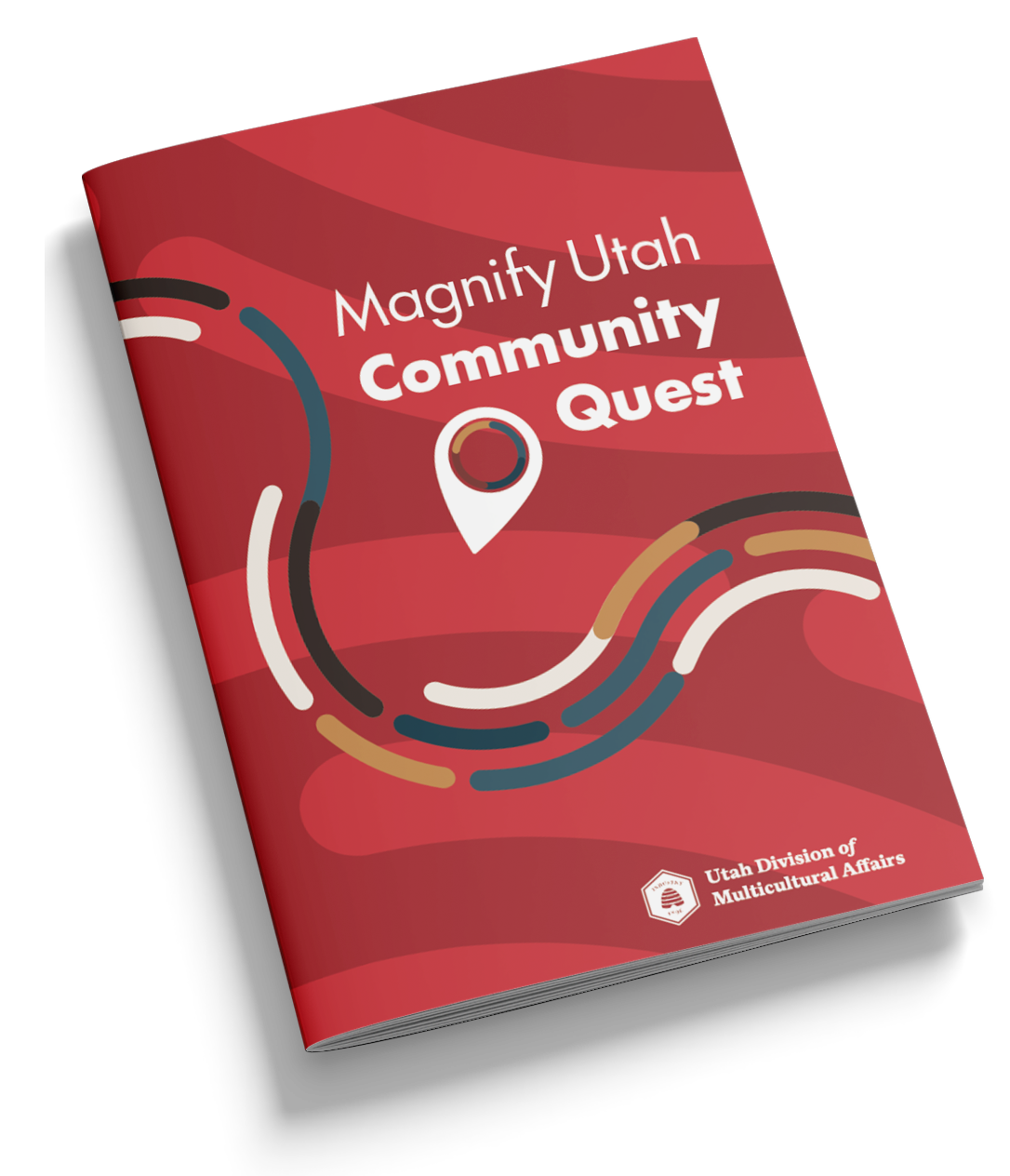 Red booklet titled Magnify Utah Community Quest by Utah Division of Multicultural Affairs.